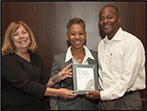 photo of TennisPlex recipients holding award